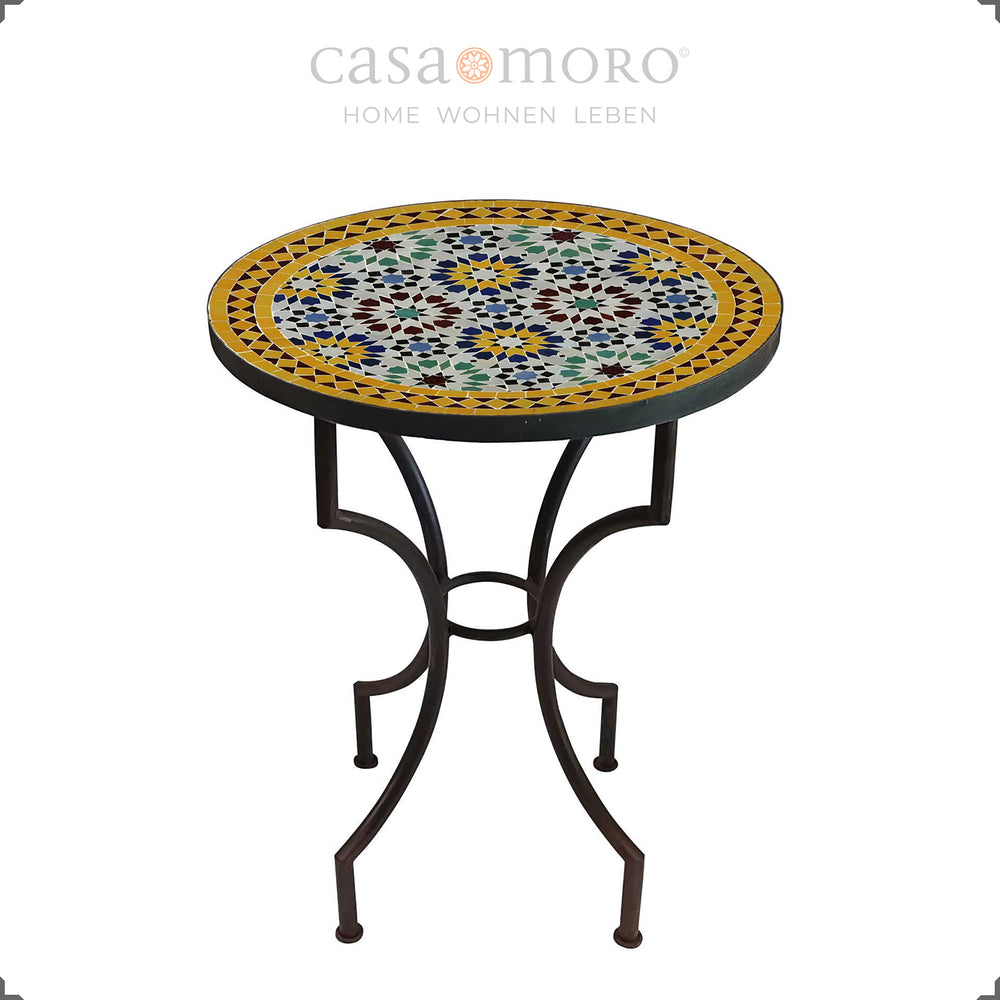 Garden table with an intense mosaic pattern in blue, yellow, burgundy and green - round table for two people