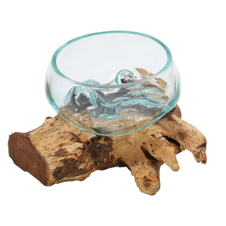 Glass bowl on root wood