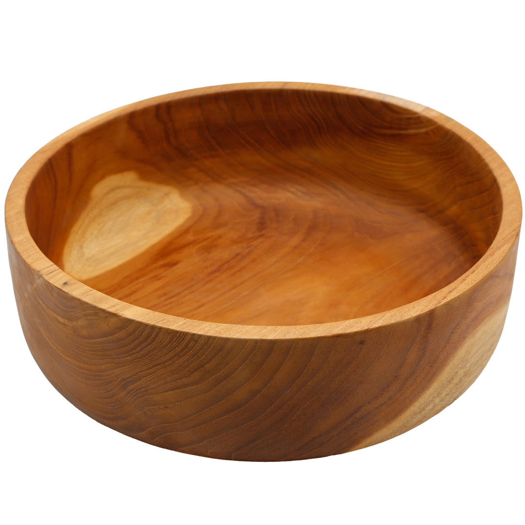 Round teak wooden bowl, photographed from above, with a gentle color gradient