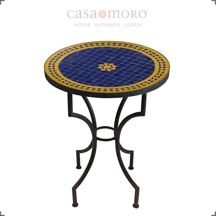 Mosaic table as a dining table for two with a star-shaped zellige pattern in blue and yellow