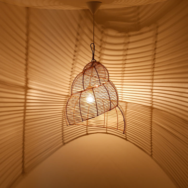Spirally shaped ceiling lamp made of rattan with fine weave, creates an impressive play of light and shadow