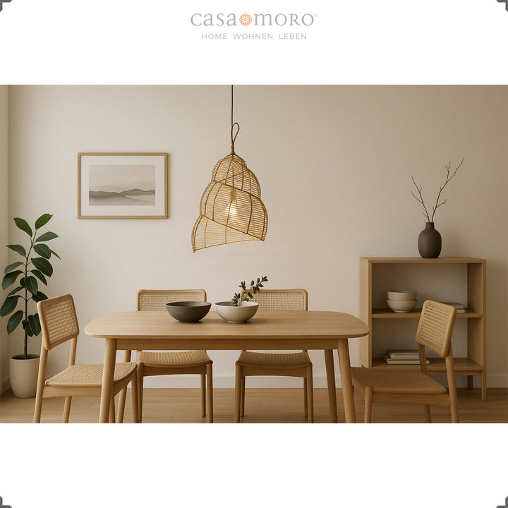 Spiral shaped rattan lamp above a dining table in the modern dining room, creates warm light and soft shadows