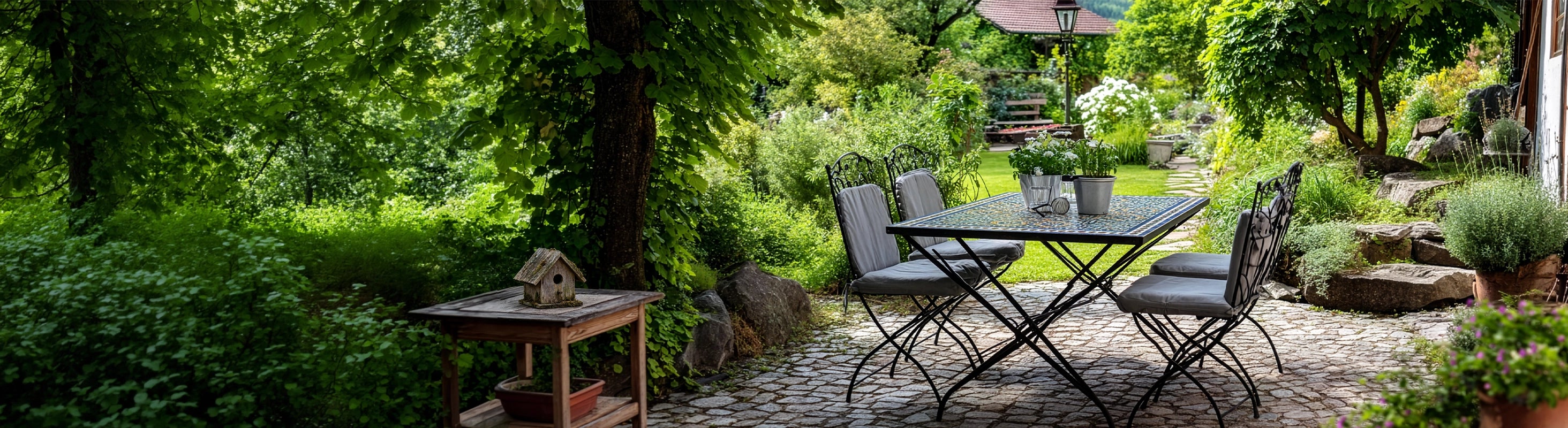 Garden & Terrace – Garden with mosaic table and seating area on a natural stone path under trees - stylish outdoor area for terrace and garden furniture