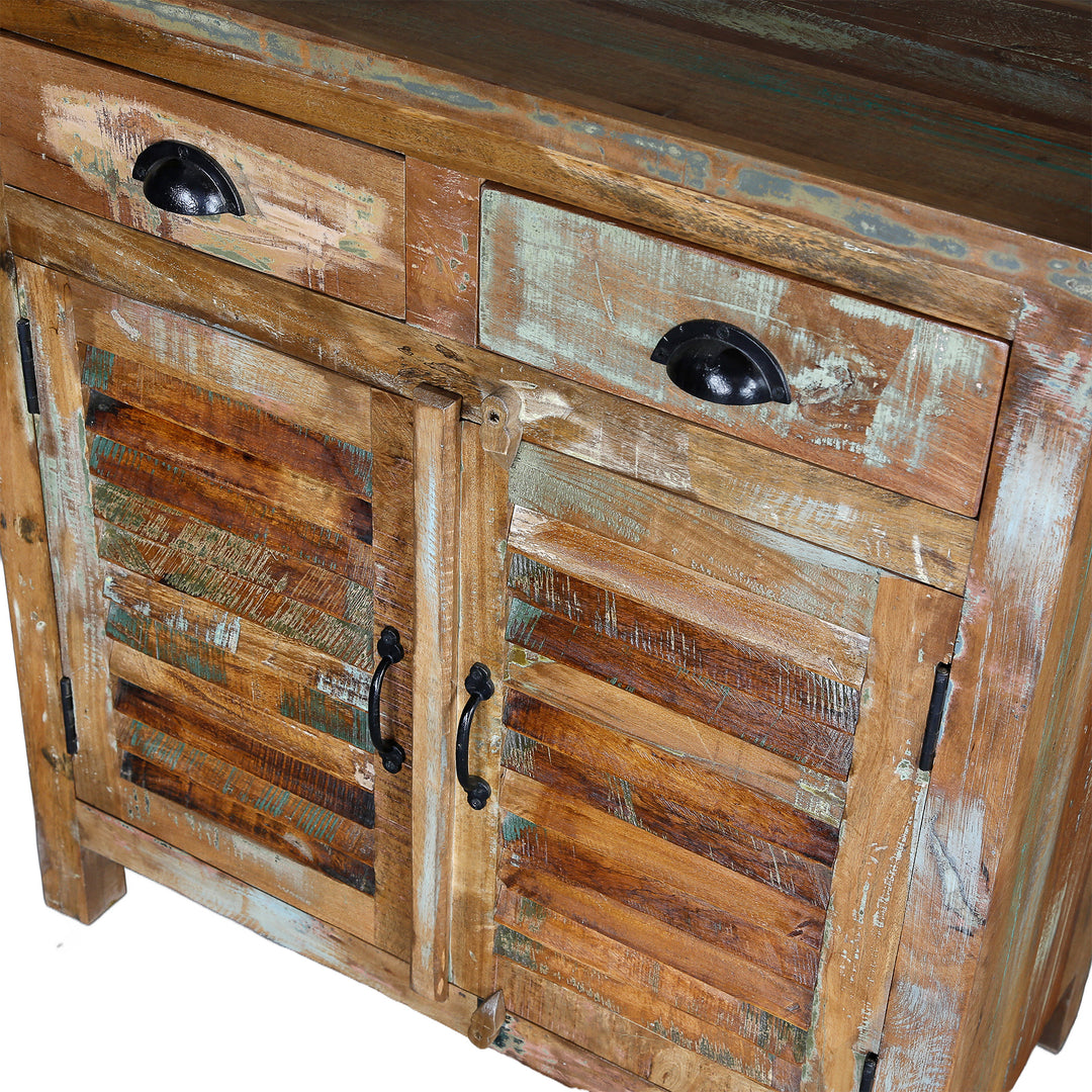 Detailed view of a highboard made of solid wood with drawers, doors and visible old wood structure