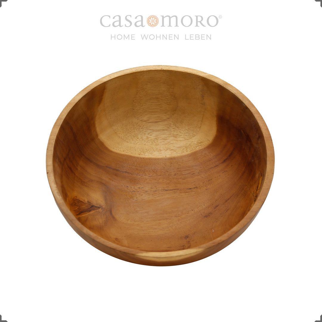 Wooden bowl photographed from above with a lively wood structure