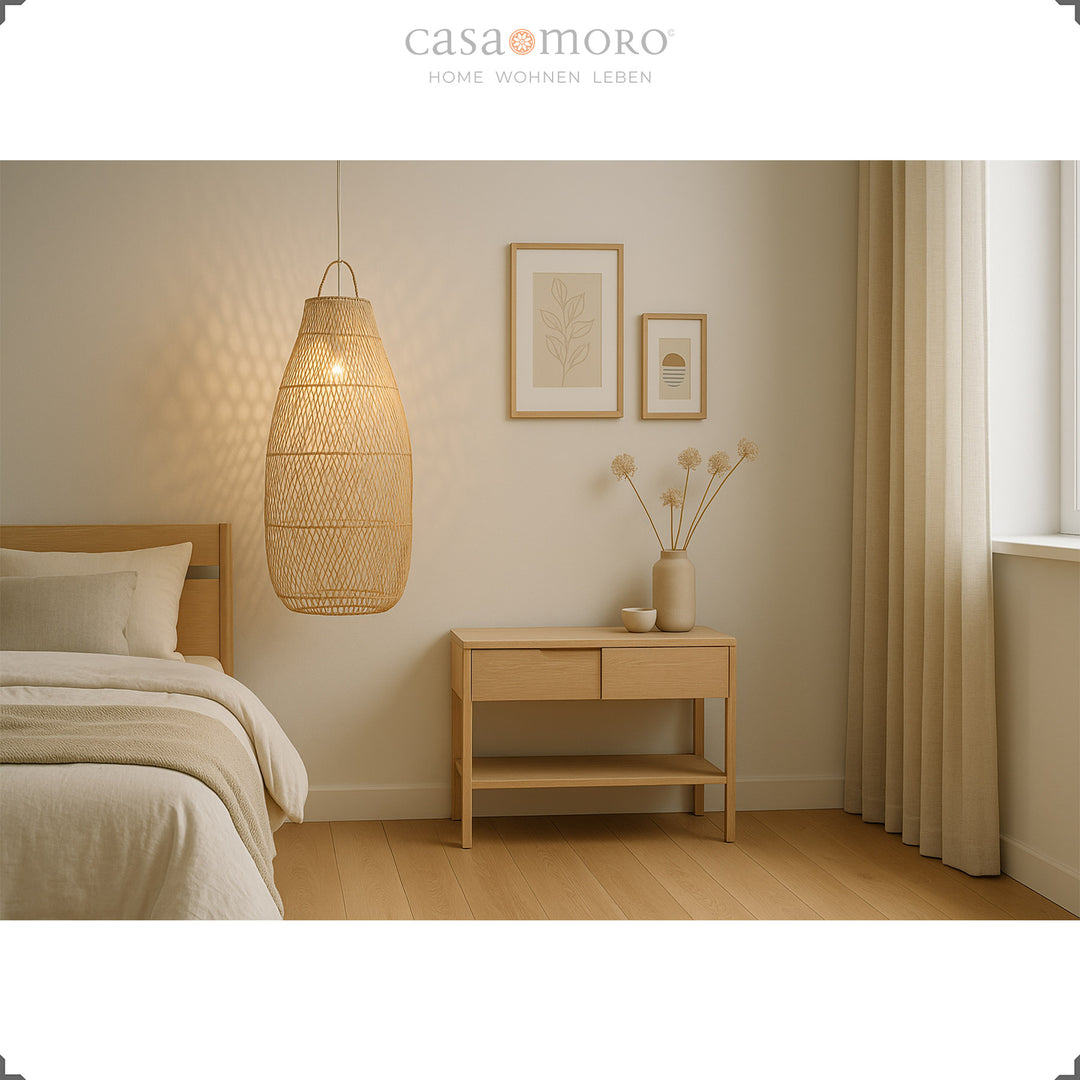 Tall rattan lamp in bedroom next to bed, soft light and bright natural decor