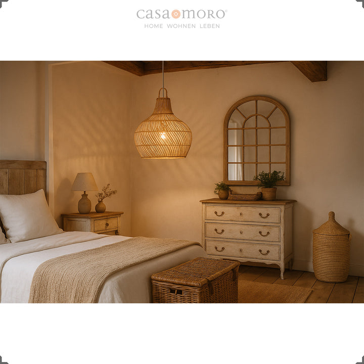 Handmade rattan lamp as a ceiling light in the bedroom, creates warm light and a cozy boho atmosphere