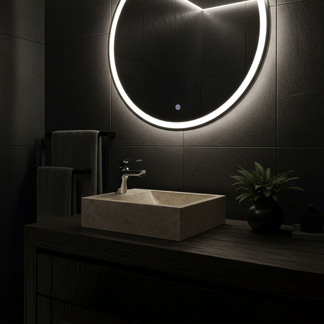 Rectangular countertop washbasin made of light marble on a dark wooden washbasin with chrome-plated fittings in the modern, minimalist bathroom