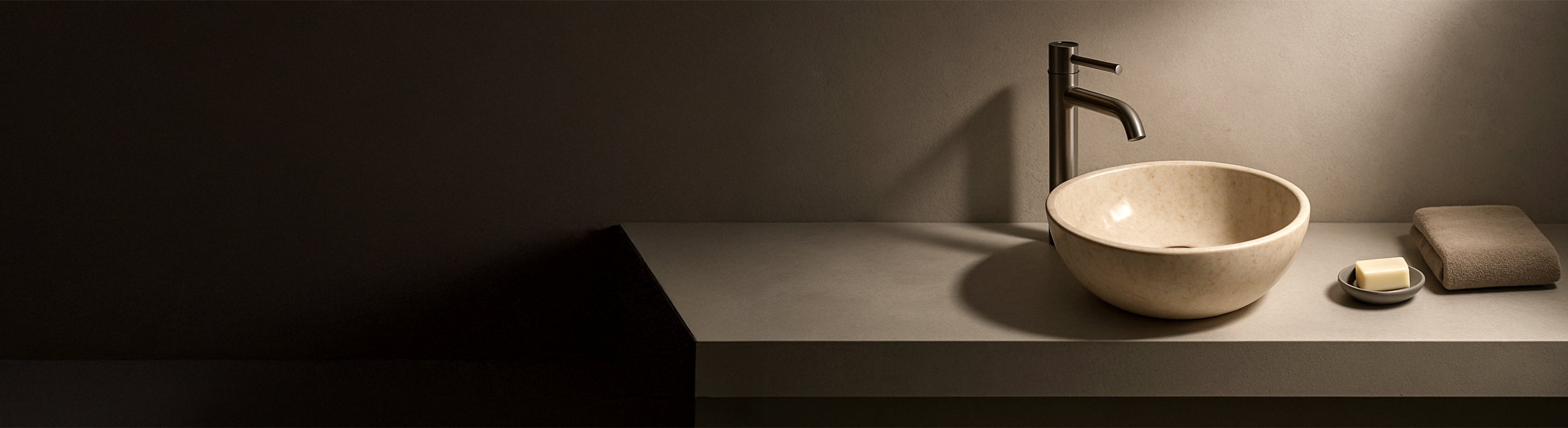 Marble Washbasin – Minimalist bathroom with natural stone Washbasin made of marble, modern and elegantly lit.