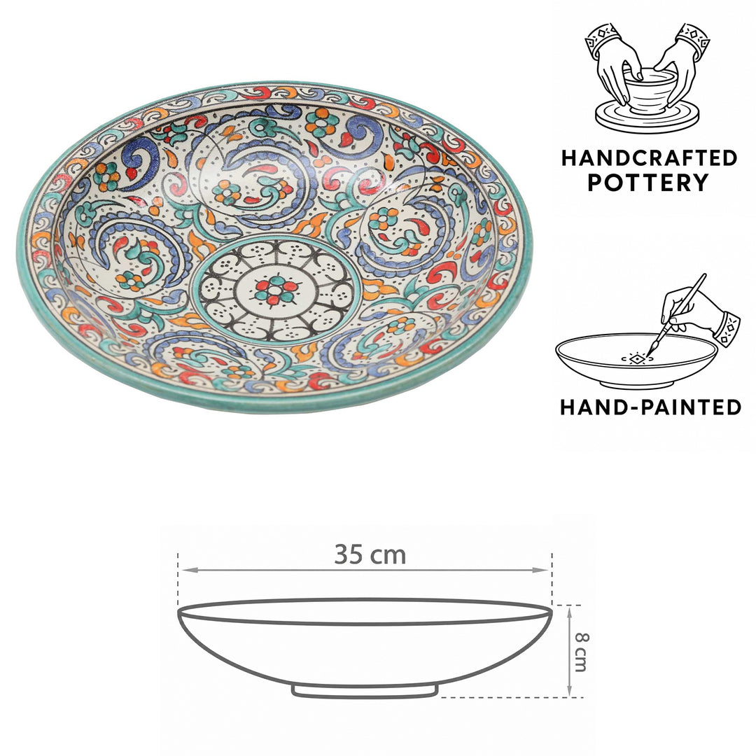 Hand-painted Moroccan ceramic bowl with a turquoise rim, floral motifs, and dimensions of Ø 35 cm and height 8 cm