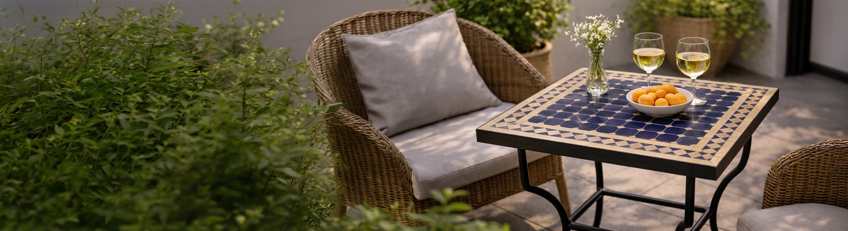 Mosaic tables 60x60 – Square table 60x60 cm with zellige tiles (mosaic) on terrace next to lounge chair with drinks and decorative bowl
