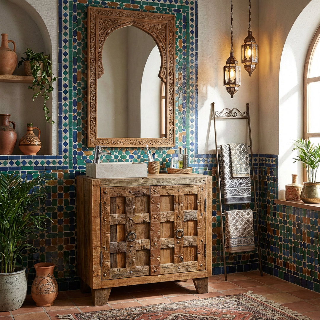 Square countertop washbasin made of light natural stone on a wooden base cabinet in an oriental bathroom with mosaic tiles