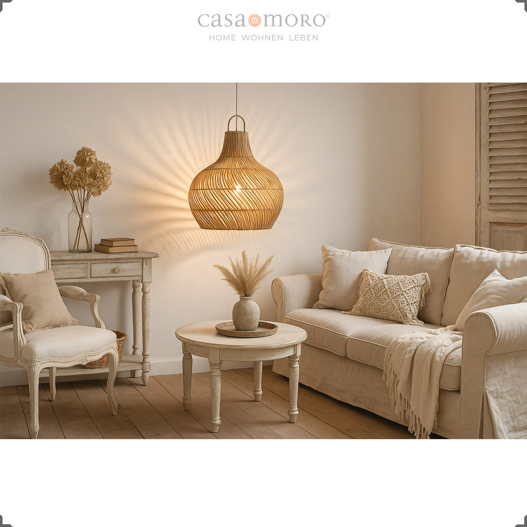 OLD: Hanging rattan lamp in a bright living room, handmade and with a warm play of light and shadow