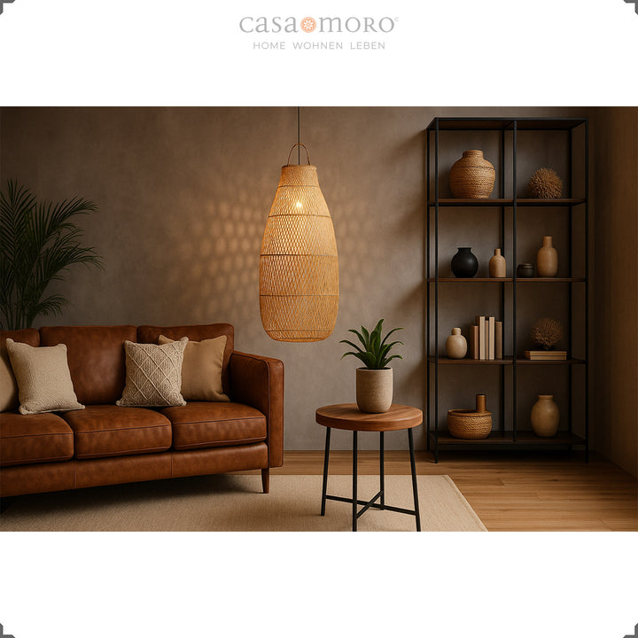 Large rattan lamp in the living room with leather sofa and warm light for a cozy atmosphere