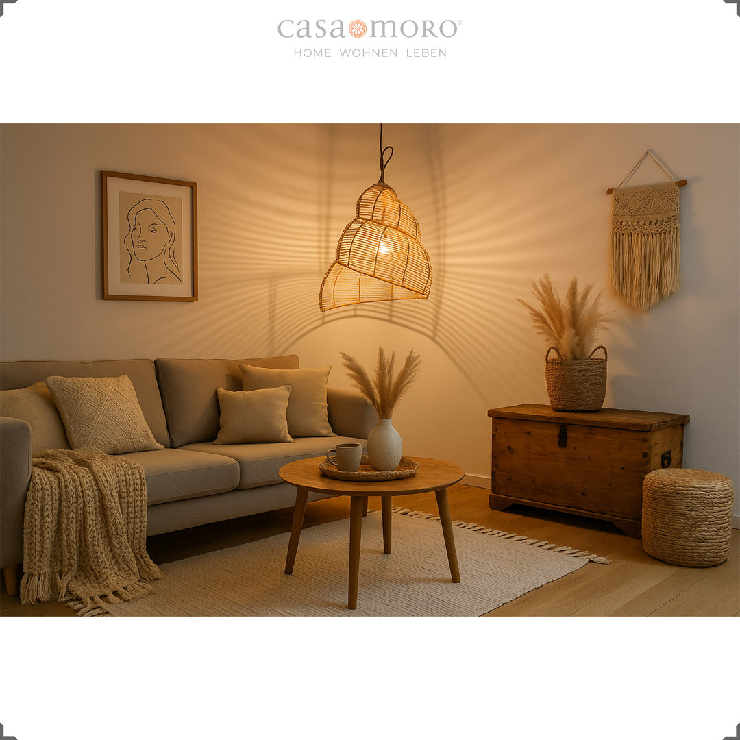 Spiral-shaped rattan lamp as a hanging lamp in the living room, provides warm light and creates a cozy boho atmosphere