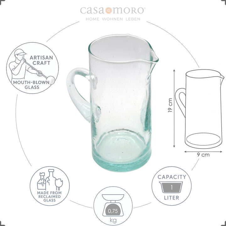 Carafe with fruit juice and ice - made from clear, hand-blown glass