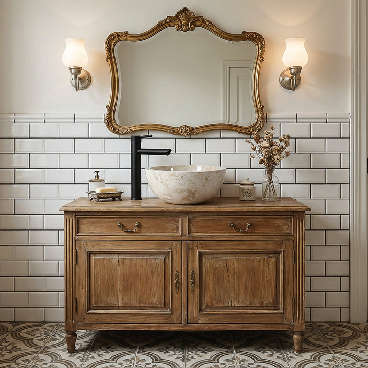 Round stone washbasin as an attachment on an antique wooden washbasin with a black fitting in a classic, elegant bathroom ambience