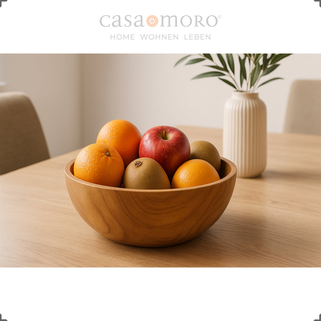 Wooden bowl with fruit on the table, ideal as a table decoration