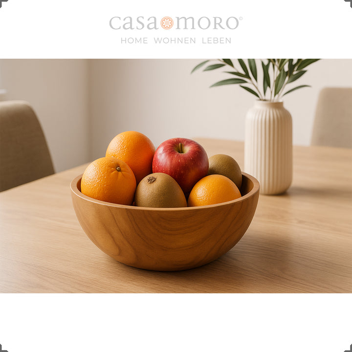 Wooden bowl with fruit on the table, ideal as a table decoration