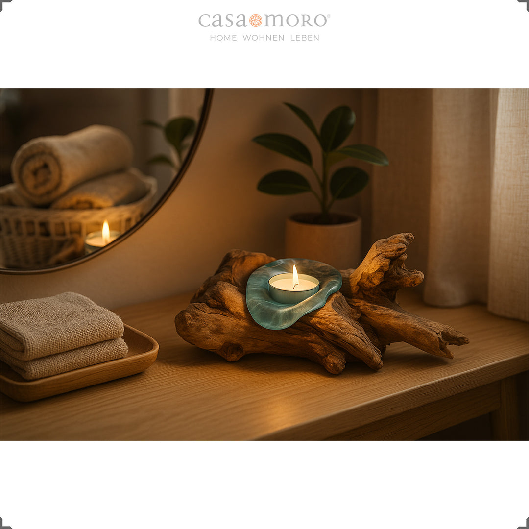 Tealight holder made of glass and burl wood on a console, its warm candlelight creates a gentle, homely atmosphere.