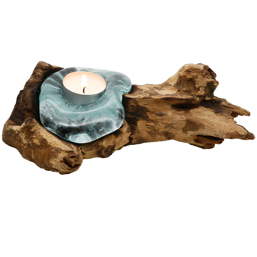 Tea light holder made of glass on natural root wood, handmade and as a small light object for warm accents in the room.
