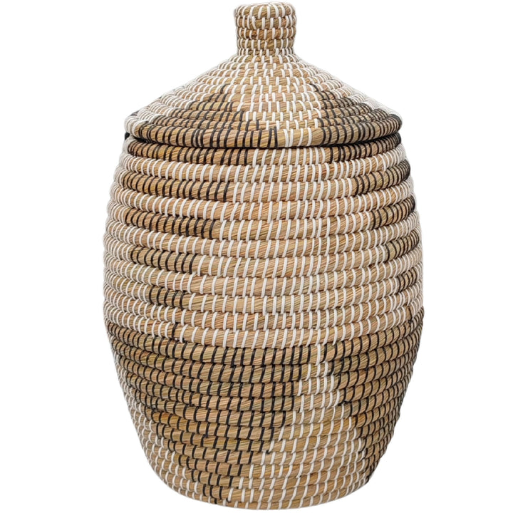 A rounded laundry basket made of seagrass in natural, brown, black, and white, with a conical lid and a capacity of approximately 30 liters.