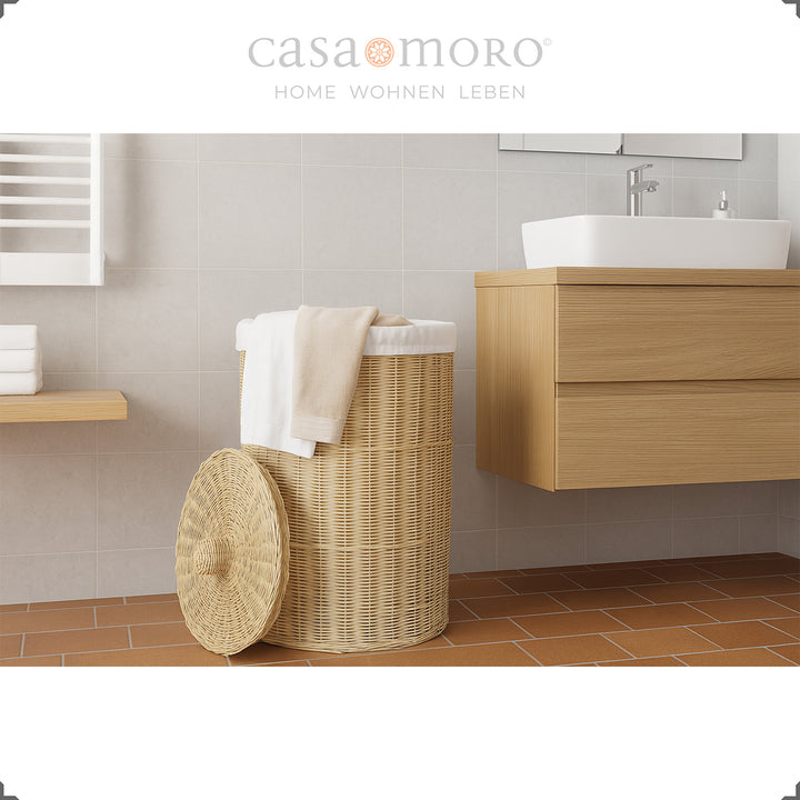 Natural color braided laundry basket with lid decorated with white towel in bathroom