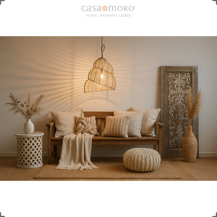 Handmade rattan lamp as a hanging lamp in the living room, with warm light and decorative boho style